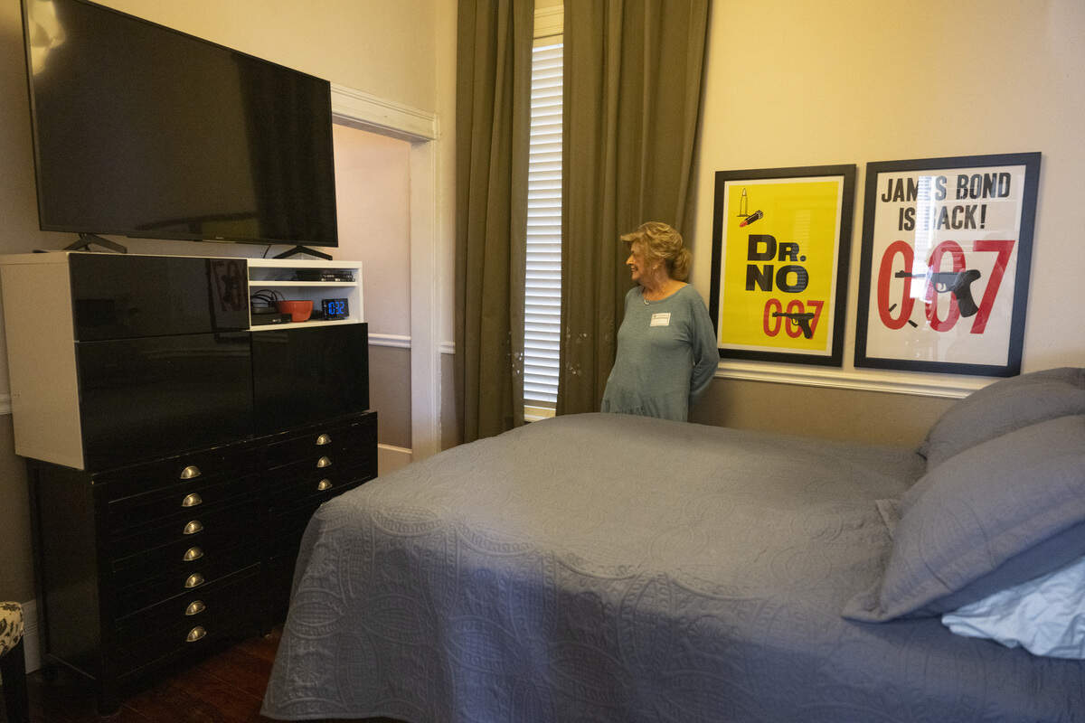A Preservation Sacramento docent stands in the bedroom of the former home of serial killer Dorothea Puente, now known as The Innocent House, during Preservation Sacramento’s annual historic home tour in Sacramento on Sunday.